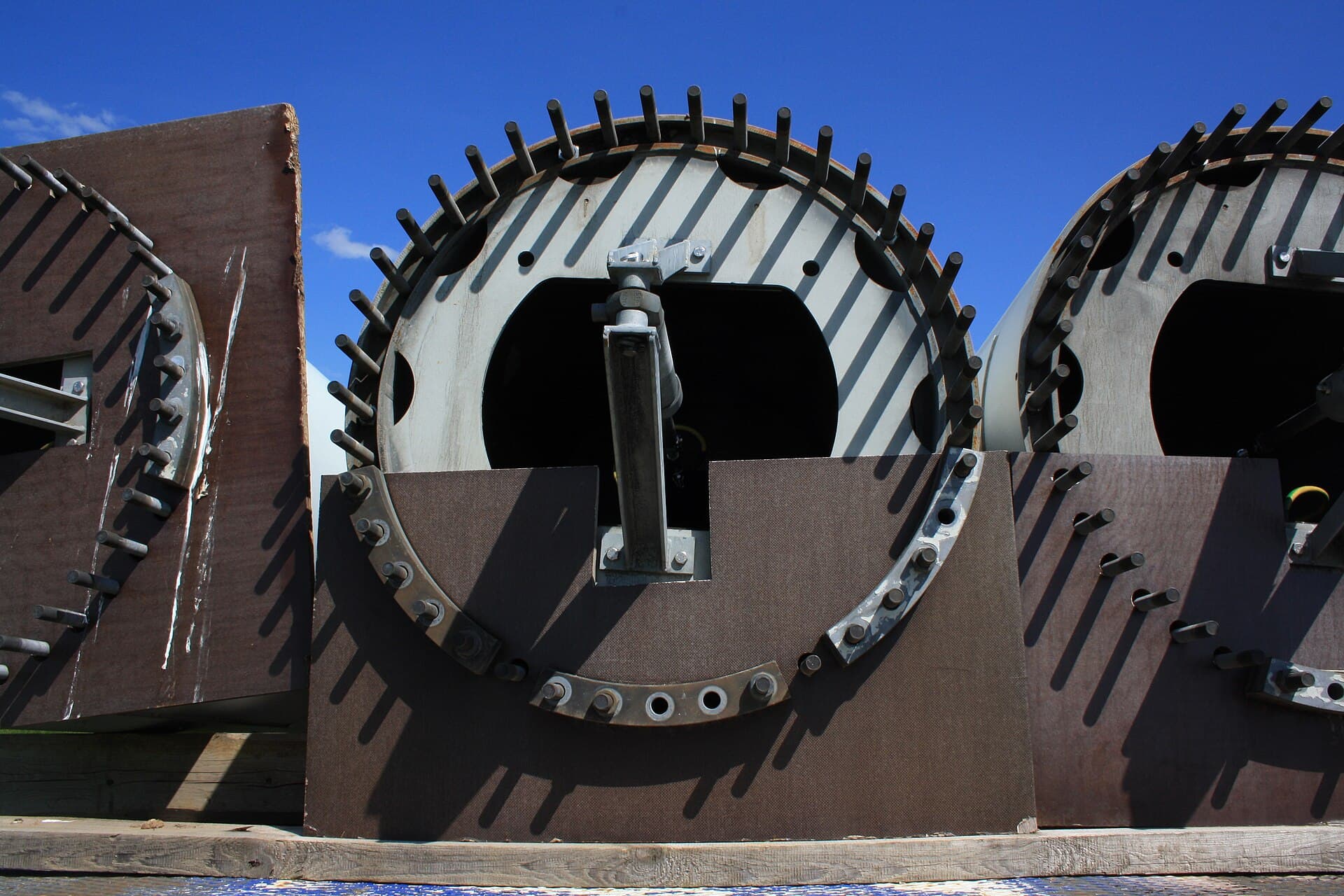 Close view of a wind turbine nacelle and blade root