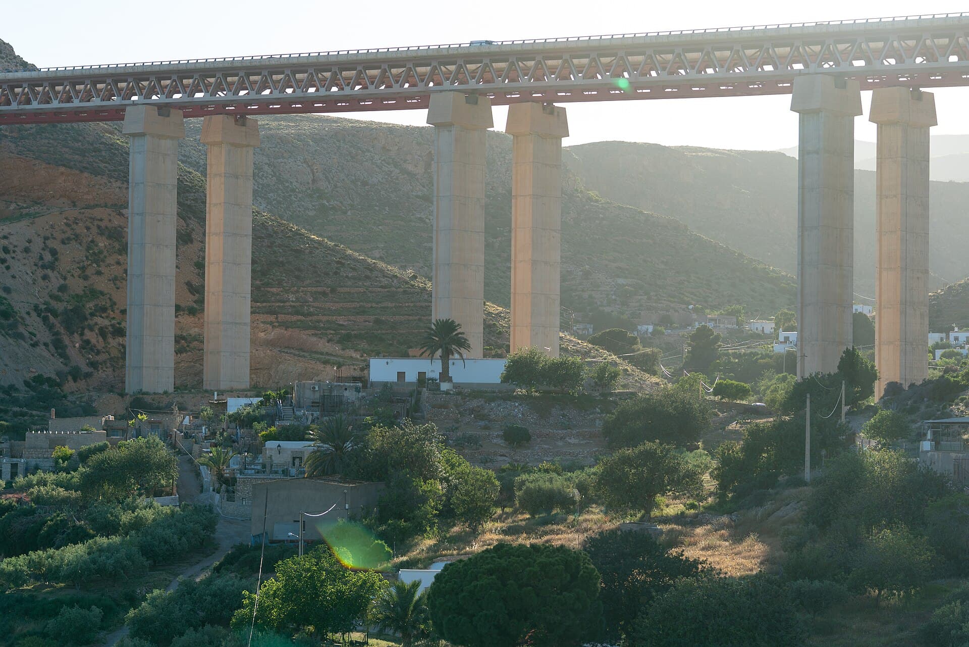 A motorway viaduct on tall concrete piers crossing a valley