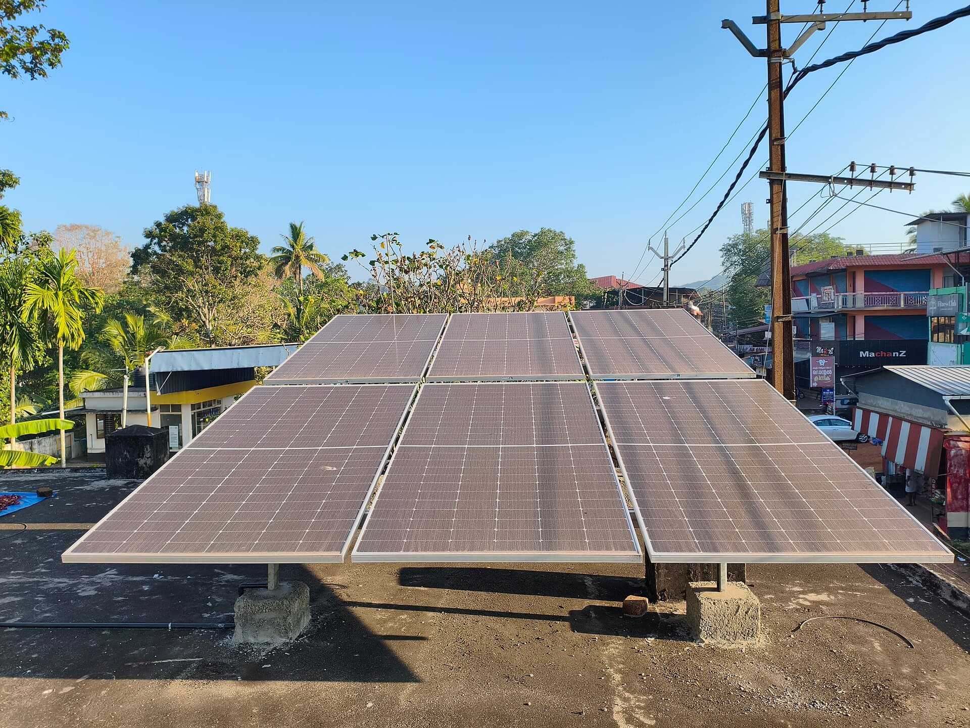 A technician working on a solar array in the field